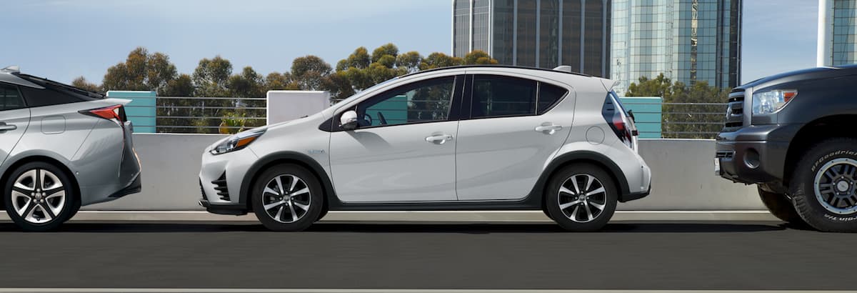 A white 2019 Prius C parallel parked