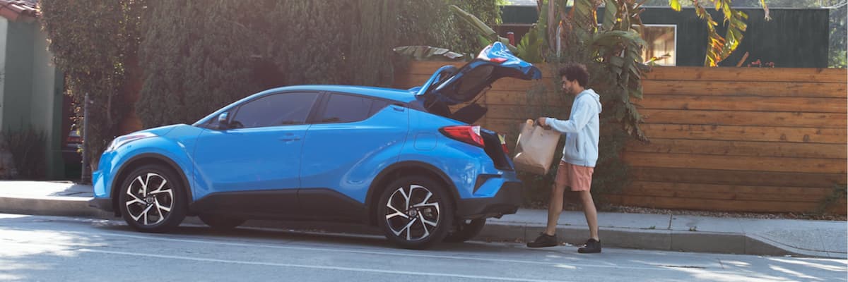 2019 Toyota C-HR A man loading groceries into his 2019 Toyota C-HR
