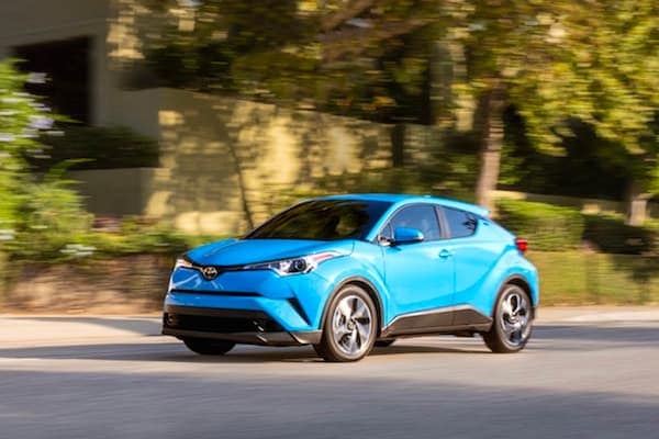 2019 Toyota C-HR A blue 2019 Toyota C-HR driving down a street