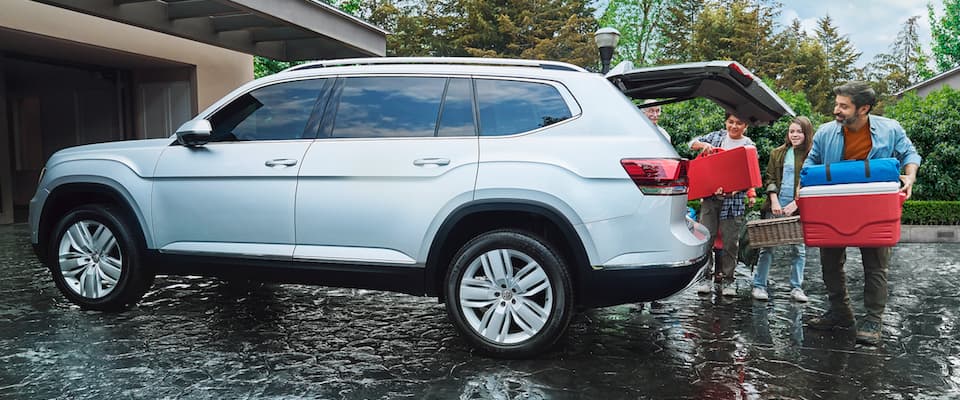 2019 VW Atlas A family loading gear into their 2019 Volkswagen Atlas