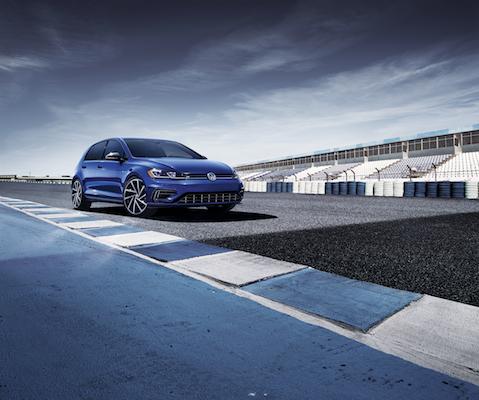 A blue 2019 Volkswagen Golf on a track