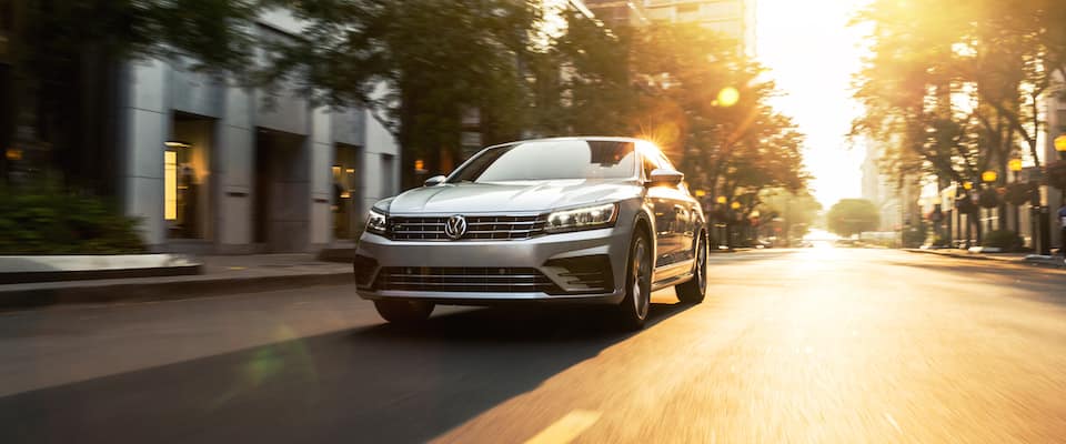 2019 Volkswagen Passat A 2019 Volkswagen Passat driving through a city at sunset