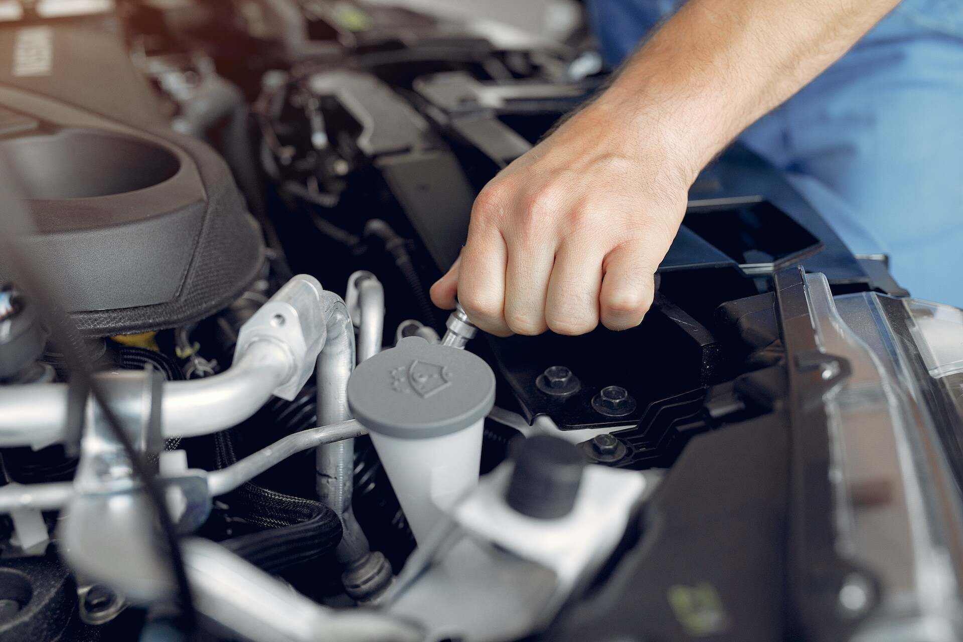 Fletcher Subaru is a Subaru Dealership in Joplin near Joplin, MO | Service technician working under the hood