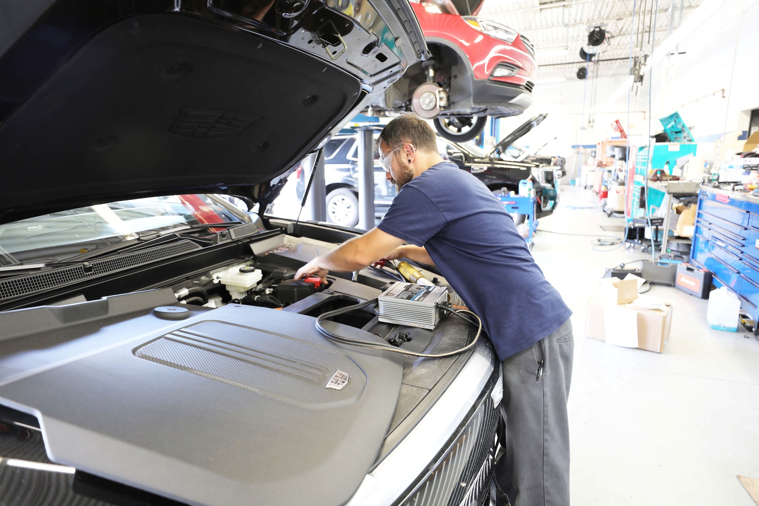 Service Technician Mounting a Tire on a Car
