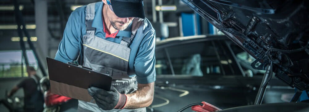 Technician Inspecting Vehicle