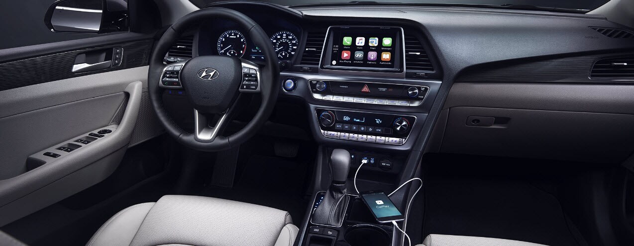Hyundai Sonata with a tan interior and black steering wheel