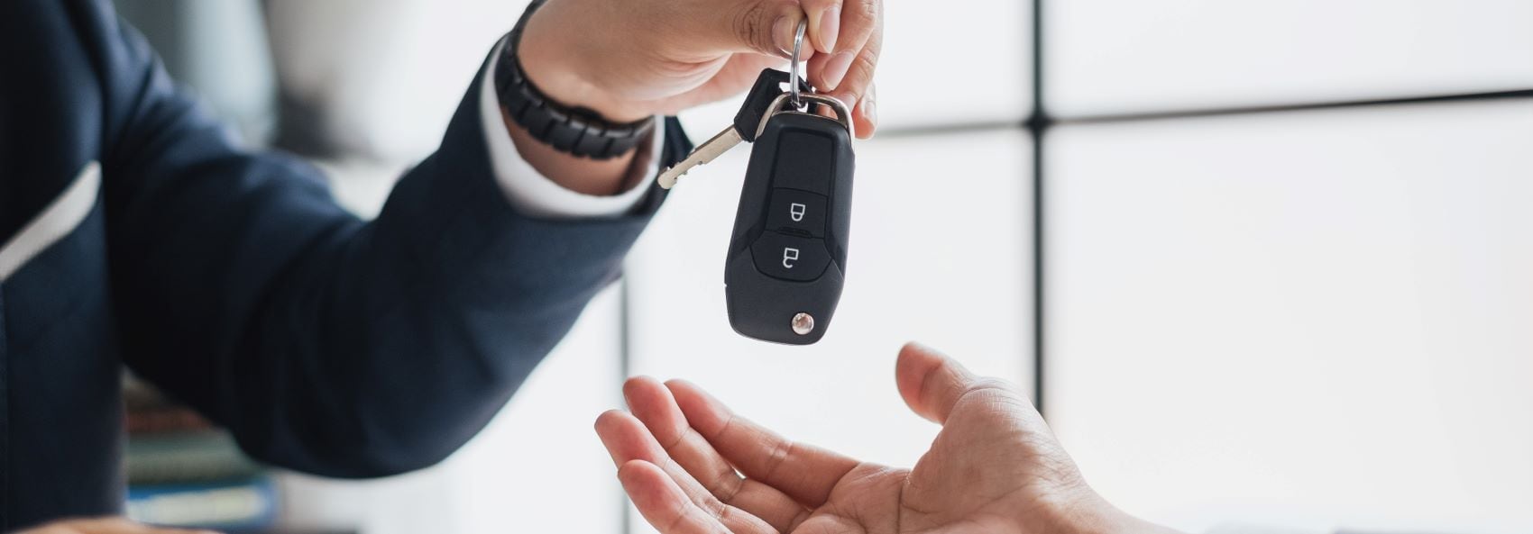 Handing over car keys to owner