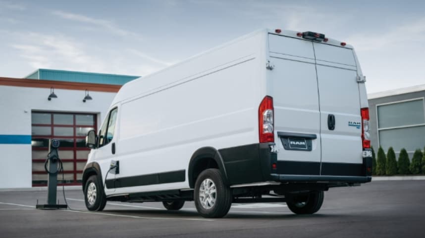 2026 RAM ProMaster EV parked, charging outside of business.