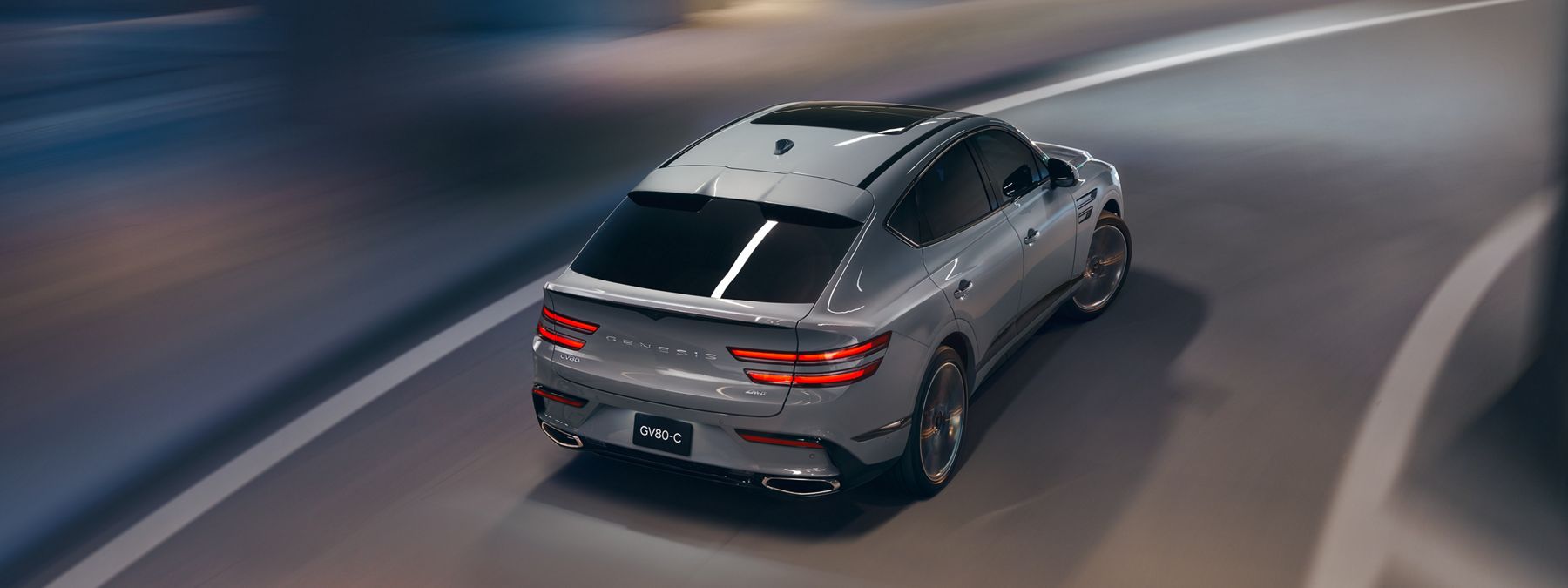 The 2026 Genesis GV80 Coupe driving through a city