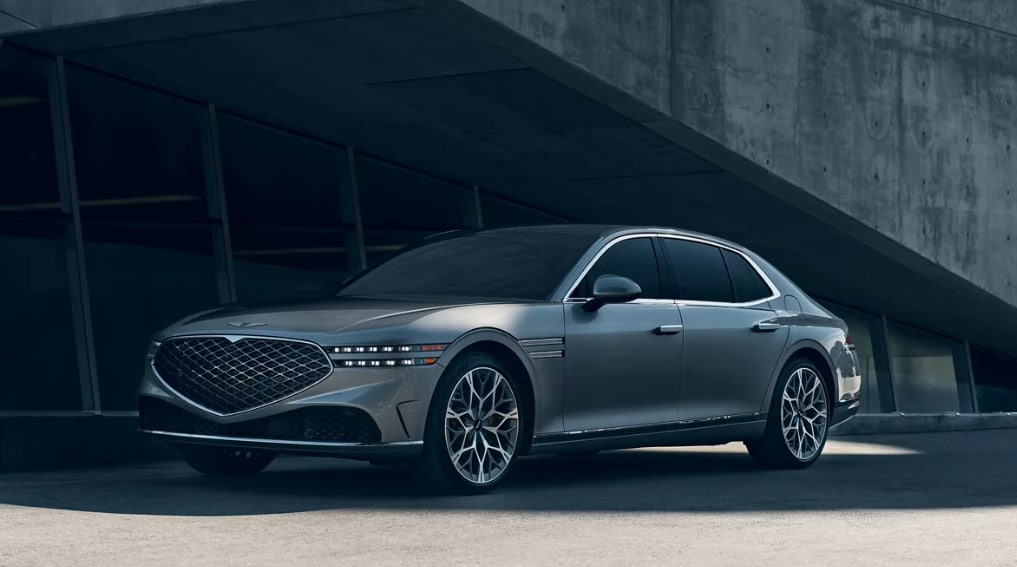 The 2026 Genesis G90 parked outside of concrete building.