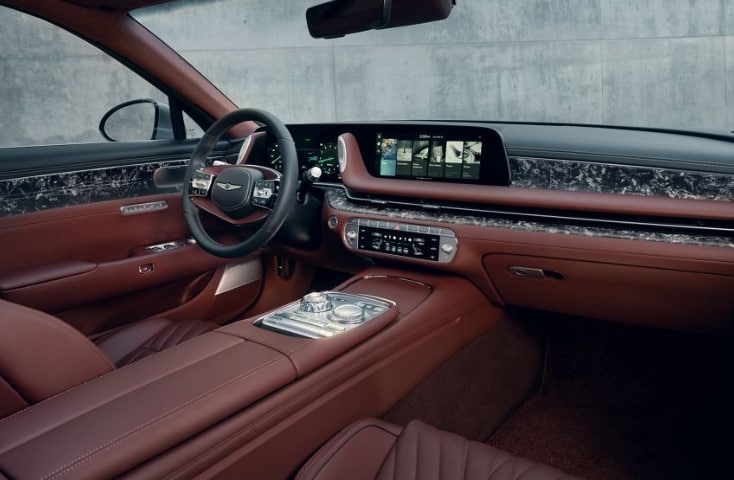 2026 Genesis G90 interior dashboard showcasing burgundy leather seating.
