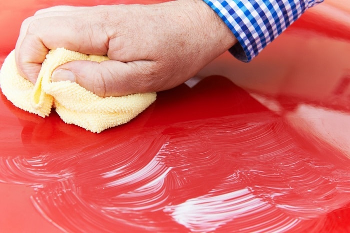 Washing car as part of Subaru maintenance
