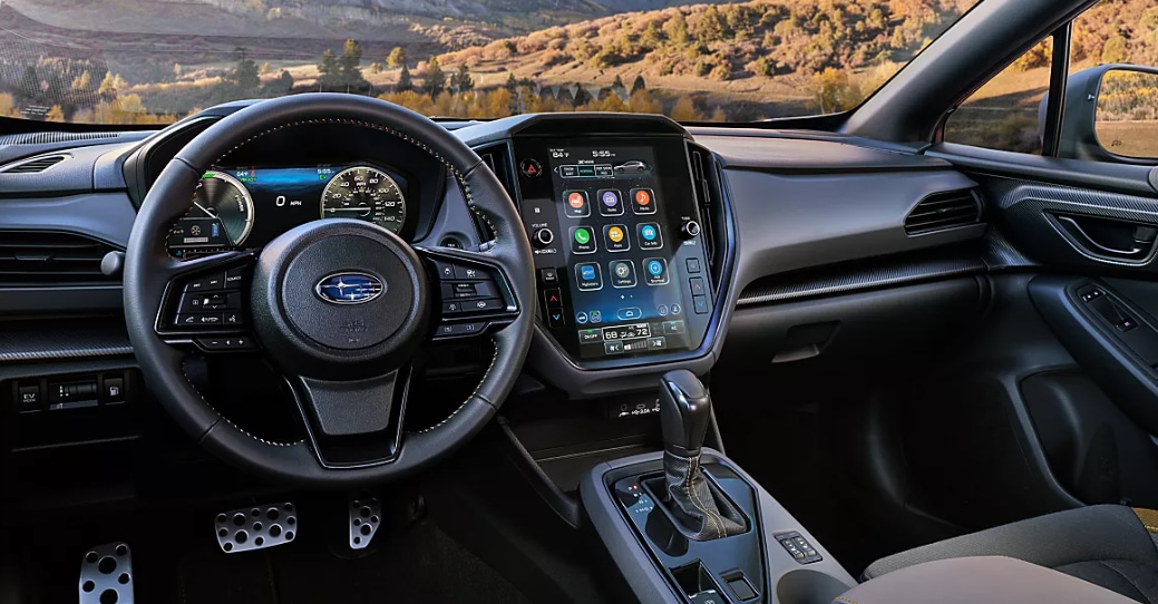 2026 Subaru Crosstrek interior with a digital gauge cluster and vertical touchscreen.