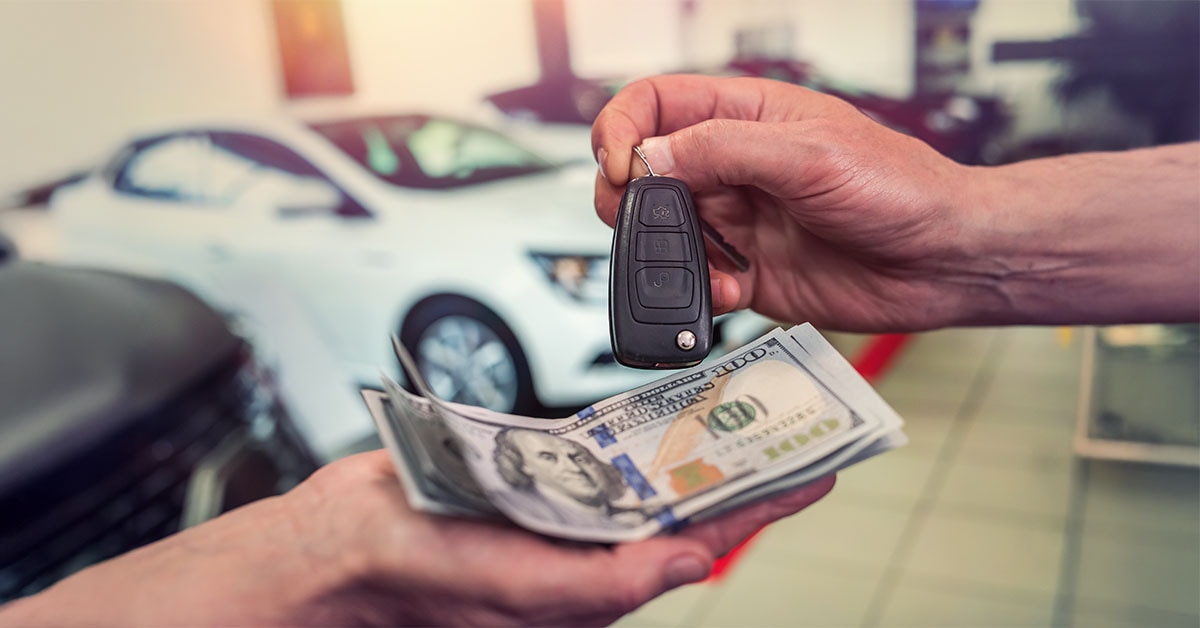 Exchanging cash and keys as part of a Subaru trade-in