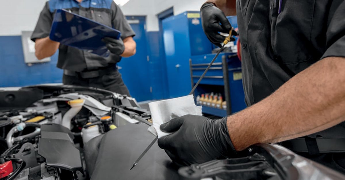 Technician performing a Subaru oil change