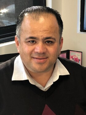 Staff member Popal Karimi from ID_5b88f7606080