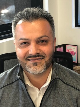 Staff member Asif Atebar from ID_5b88f7606080