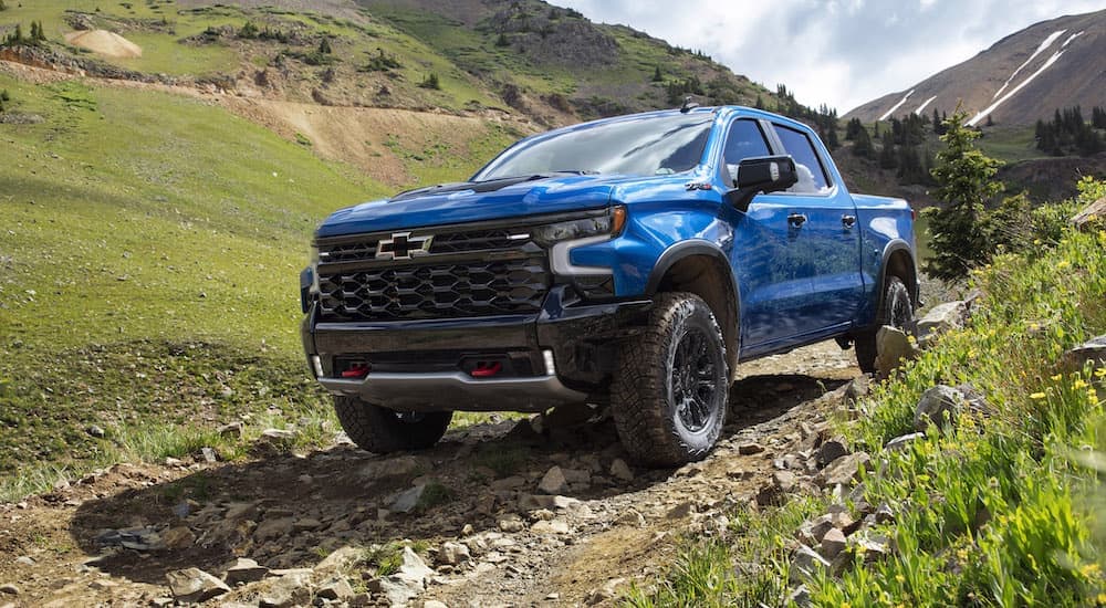 A blue 2022 Chevy Silverado 1500 ZR2 is shown from the front at an angle.