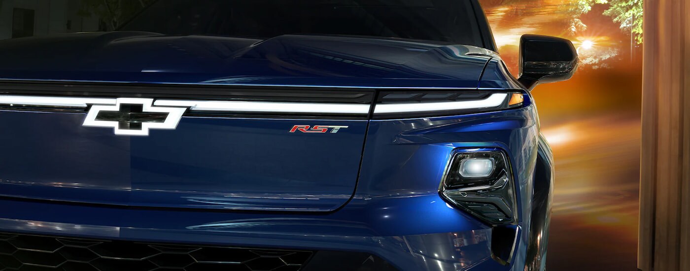 Chevy Silverado for Sale - 2024 Chevy Silverado 1500 EV - Close Grille.jpg A close up of the grille and badge on a blue 2024 Chevy Silverado EV for sale.