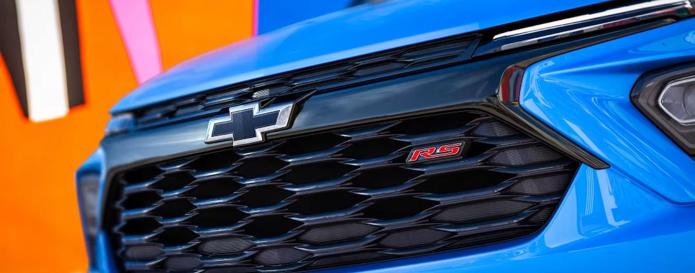 A close up of the grille on a blue 2024 Chevy Trailblazer RS is shown.