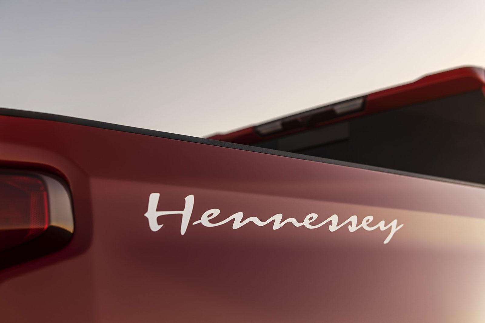 White Hennessey graphic on rear exterior of a supercharged red Chevy Silverado