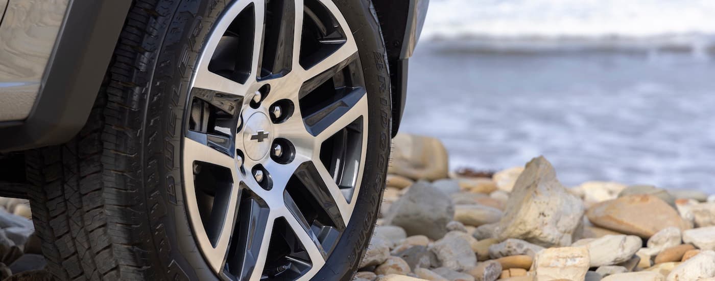 A close up shows the wheel on a silver 2023 Chevy Colorado Z71.