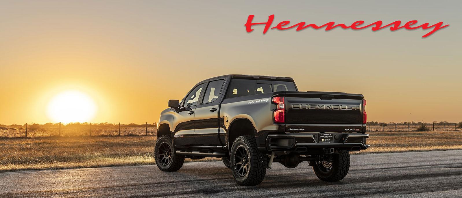 Hennessey Upgrades: A shiny black Chevy Silverado LT in front of the setting sun
