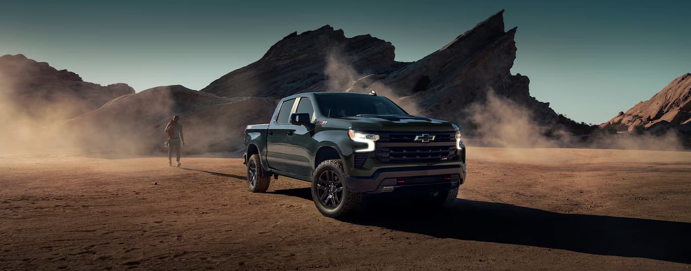 A black 2025 Chevy Silverado 1500 Z71 is parked with a mountain view.