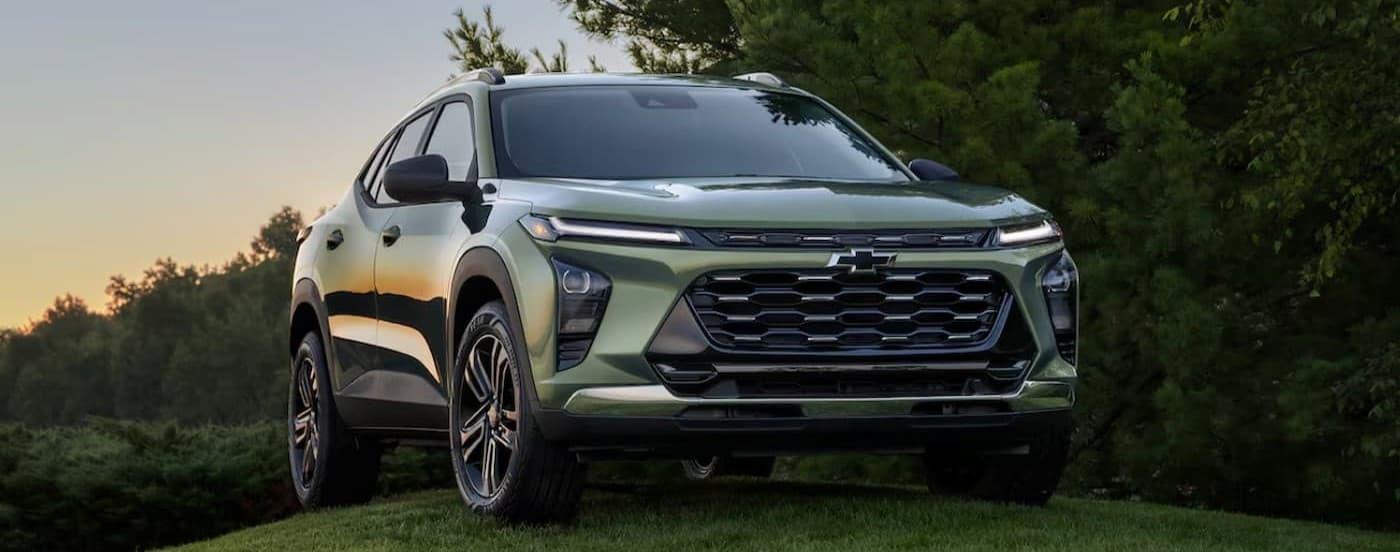 A green 2025 Chevy Trax ACTIV is shown parked after visiting a Chevy dealer near Woodland.
