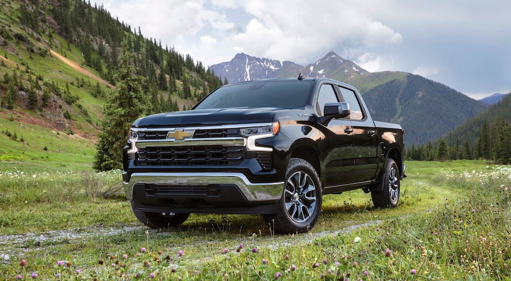 A black 2022 Chevy Silverado 1500 LT is shown from the front at an angle.