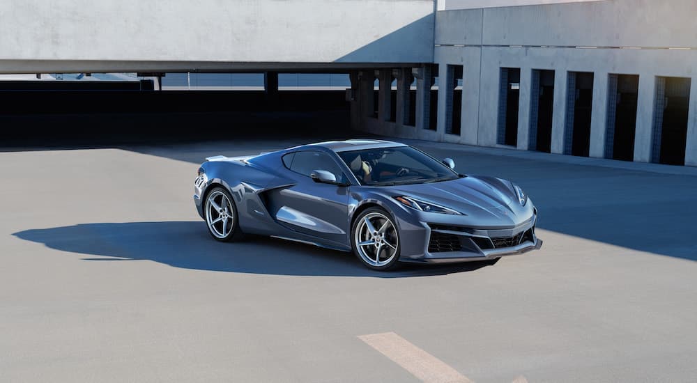 A grey 2024 Chevy Corvette E-Ray is shown from the front at an angle after leaving a Chevy dealer.
