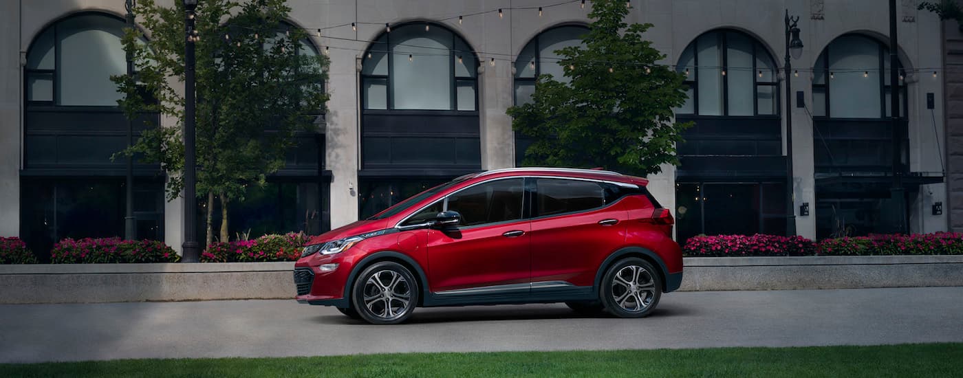 A red 2020 Chevy Bolt EV is shown from the side.