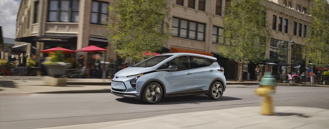A blue 2022 Chevy Bolt EV is shown from the front at an angle.