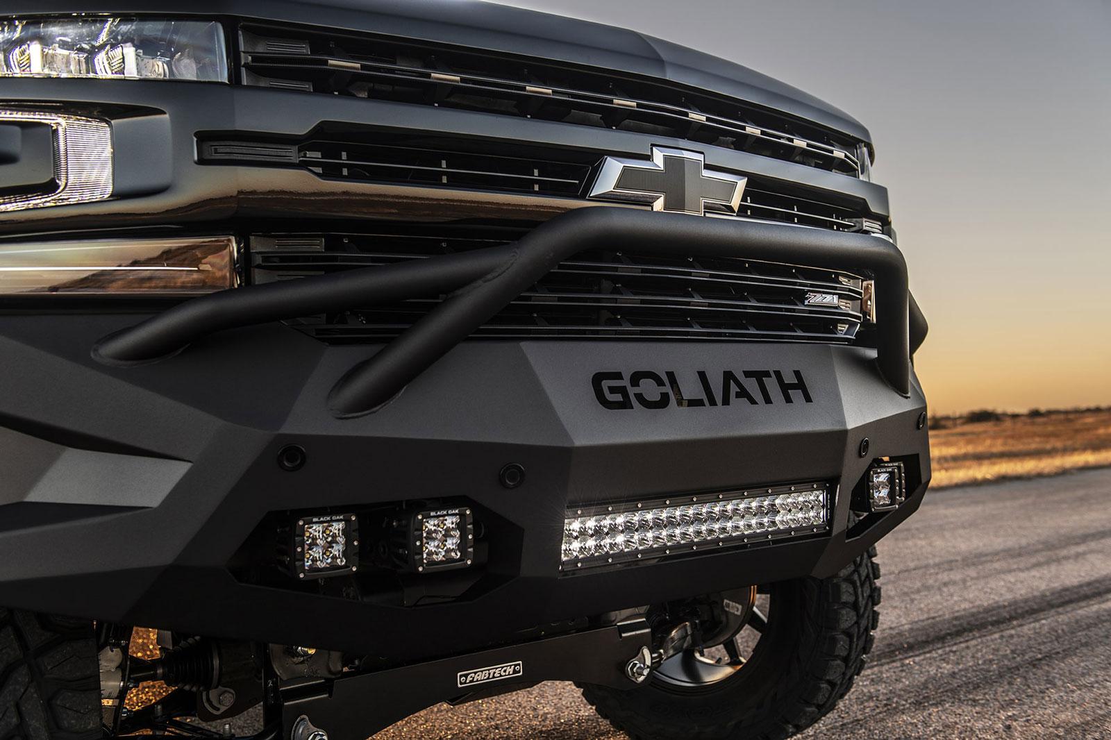 Front grill of a shiny black Chevy Silverado with Hennessey Goliath 650 Supercharged upgrades