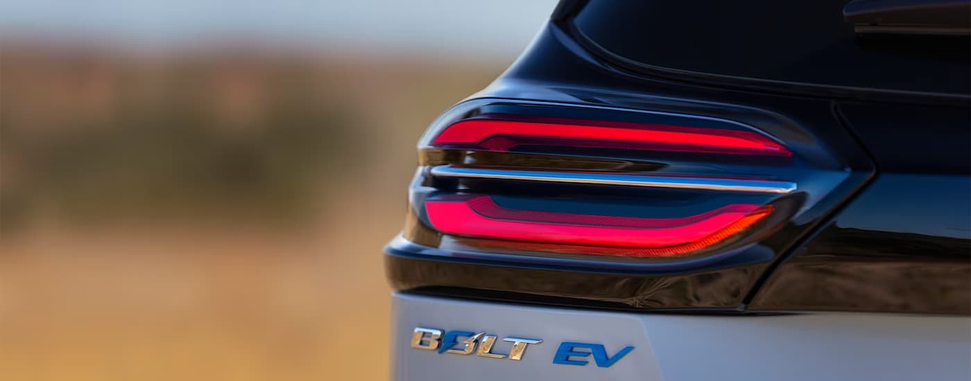 A close up of the brake light on a blue 2023 Chevy Bolt EV.