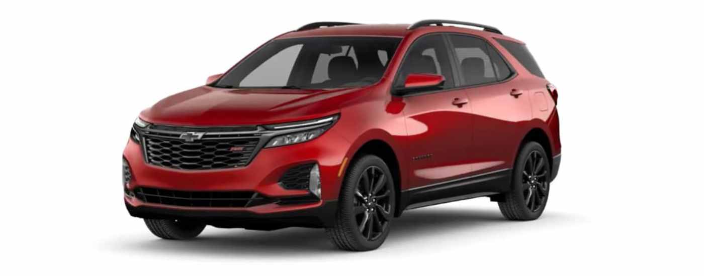 A red 2024 Chevy Equinox RS is shown angled left.