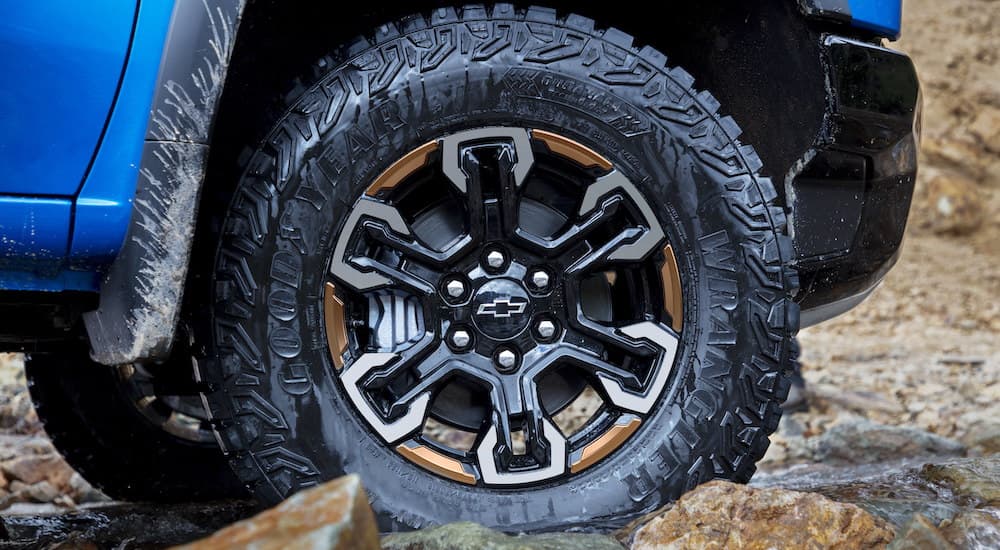 A close up shows the black wheel and tire on a  2022 Chevy Silverado 1500 ZR2.