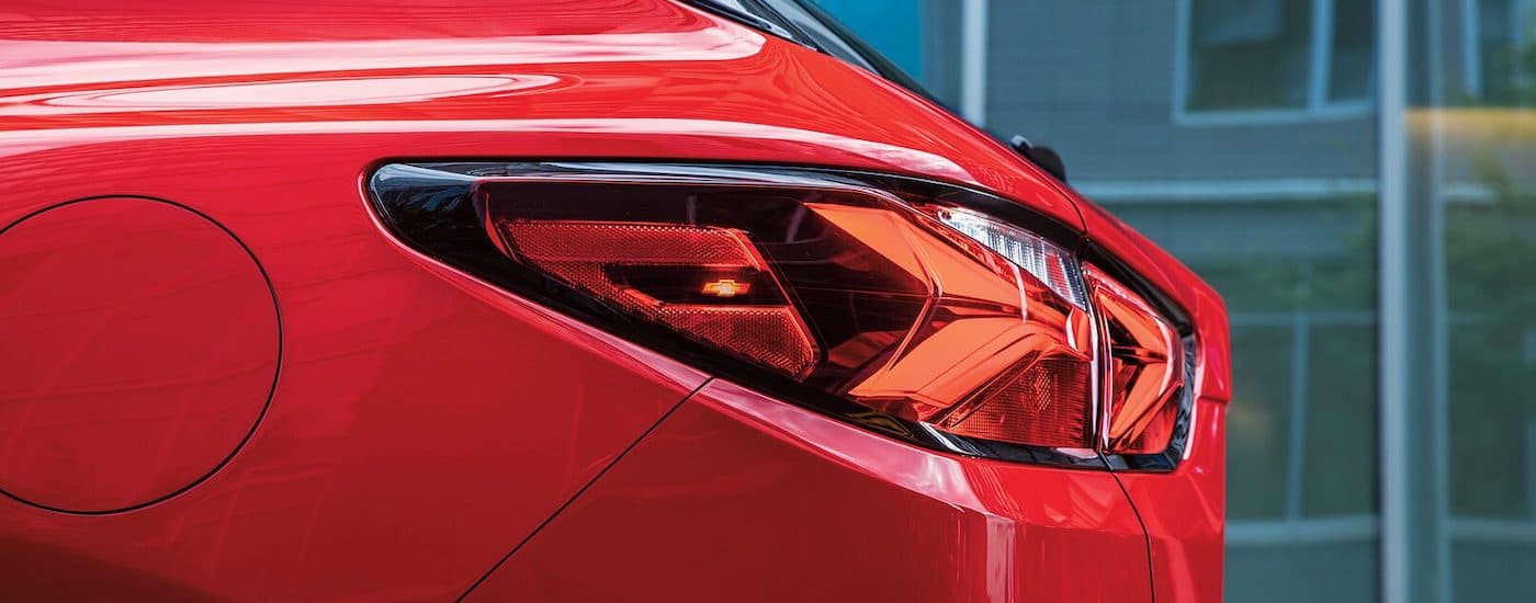 A close up shows the driver side taillight on a red 2022 Chevy Blazer RS.