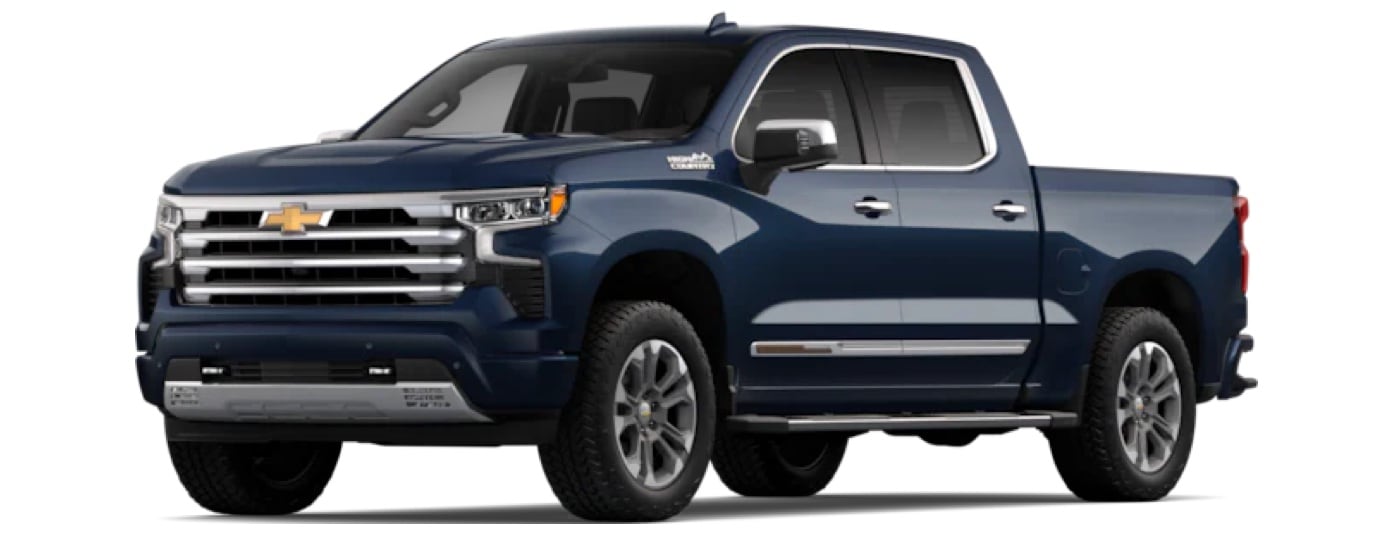 A blue 2023 Chevy Silverado 1500 High Country is shown angled left.