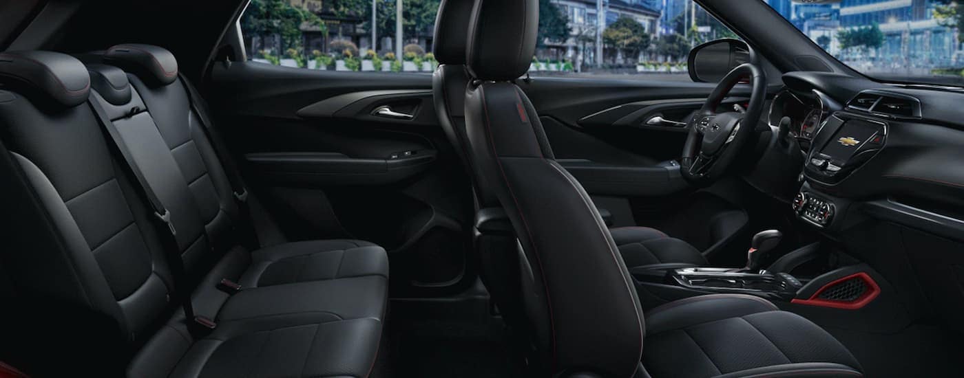 The black interior of a 2023 Chevy Trailblazer RS shows two rows of seating.