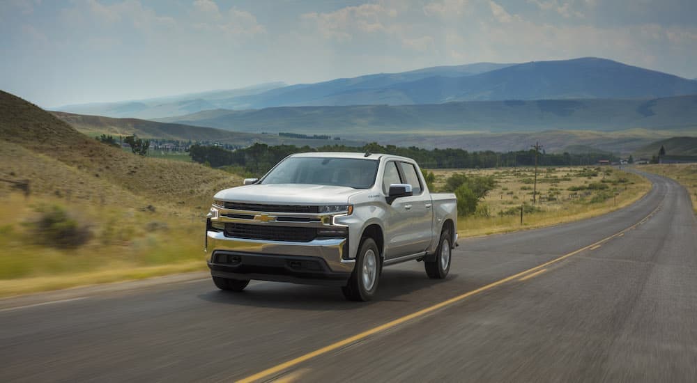 Certified Pre-Owned Chevy Silverado - 2019 Chevy Silverado 1500 LT - Silver.jpg A popular Certified Pre-Owned Chevy Silverado, silver 2019 Chevy Silverado 1500 LT, is shown driving on a country road.