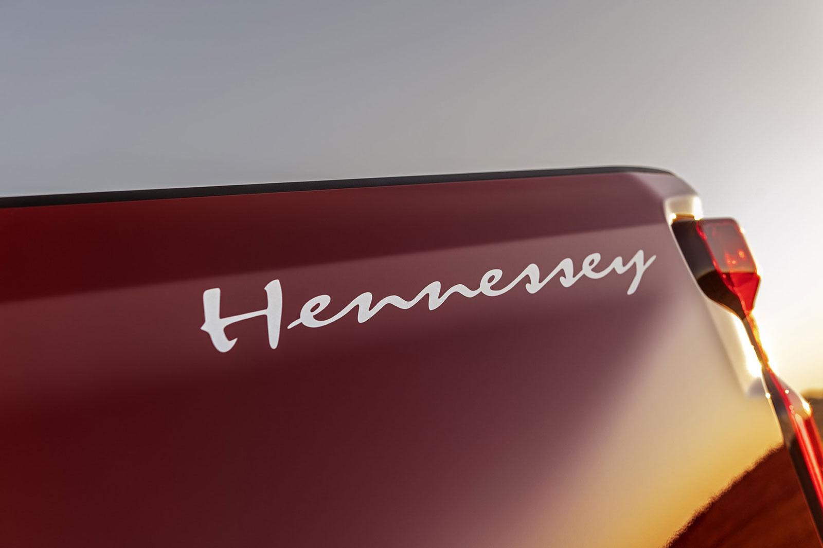 White Hennessey graphic on exterior of a supercharged red Chevy Silverado