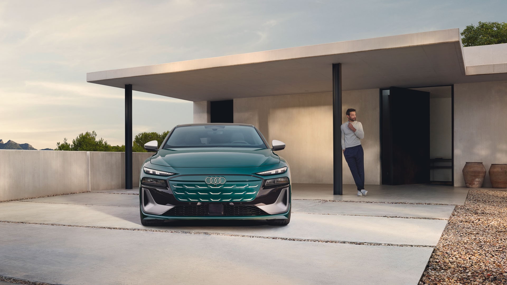 The Audi S6 e-tron 2025 parked in front of a residence.