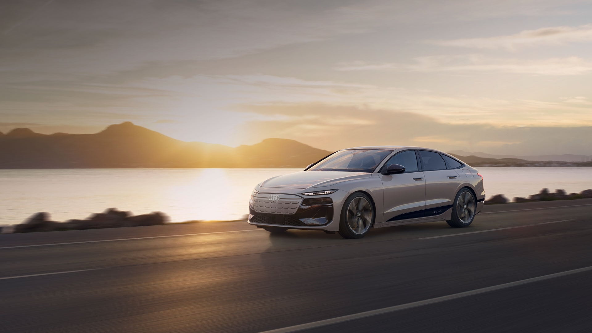 The Audi A6 e-tron 2025 demonstrating its power on the road at sunset.