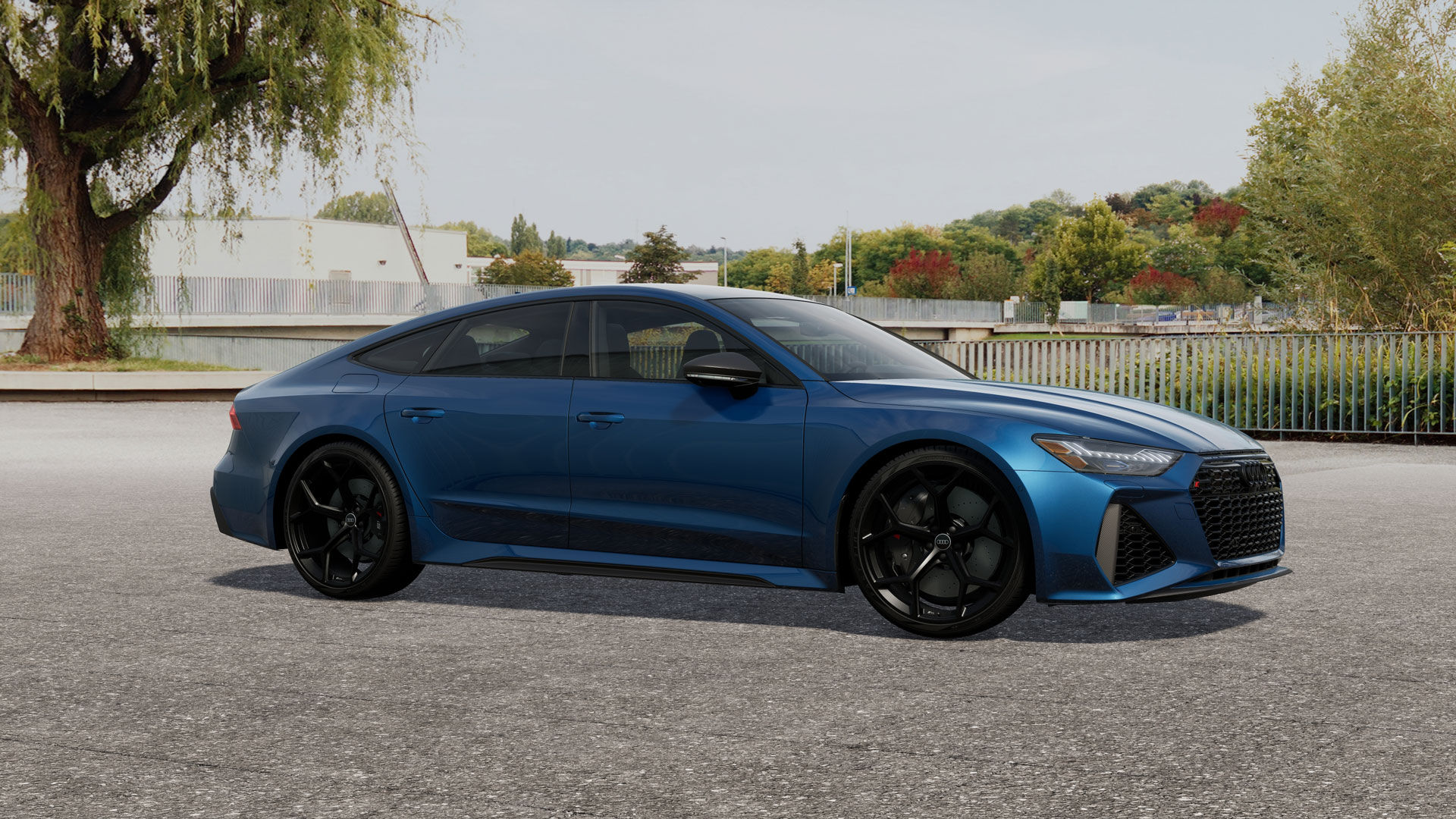 The Audi RS 7 2025 parked at the edge of a park.