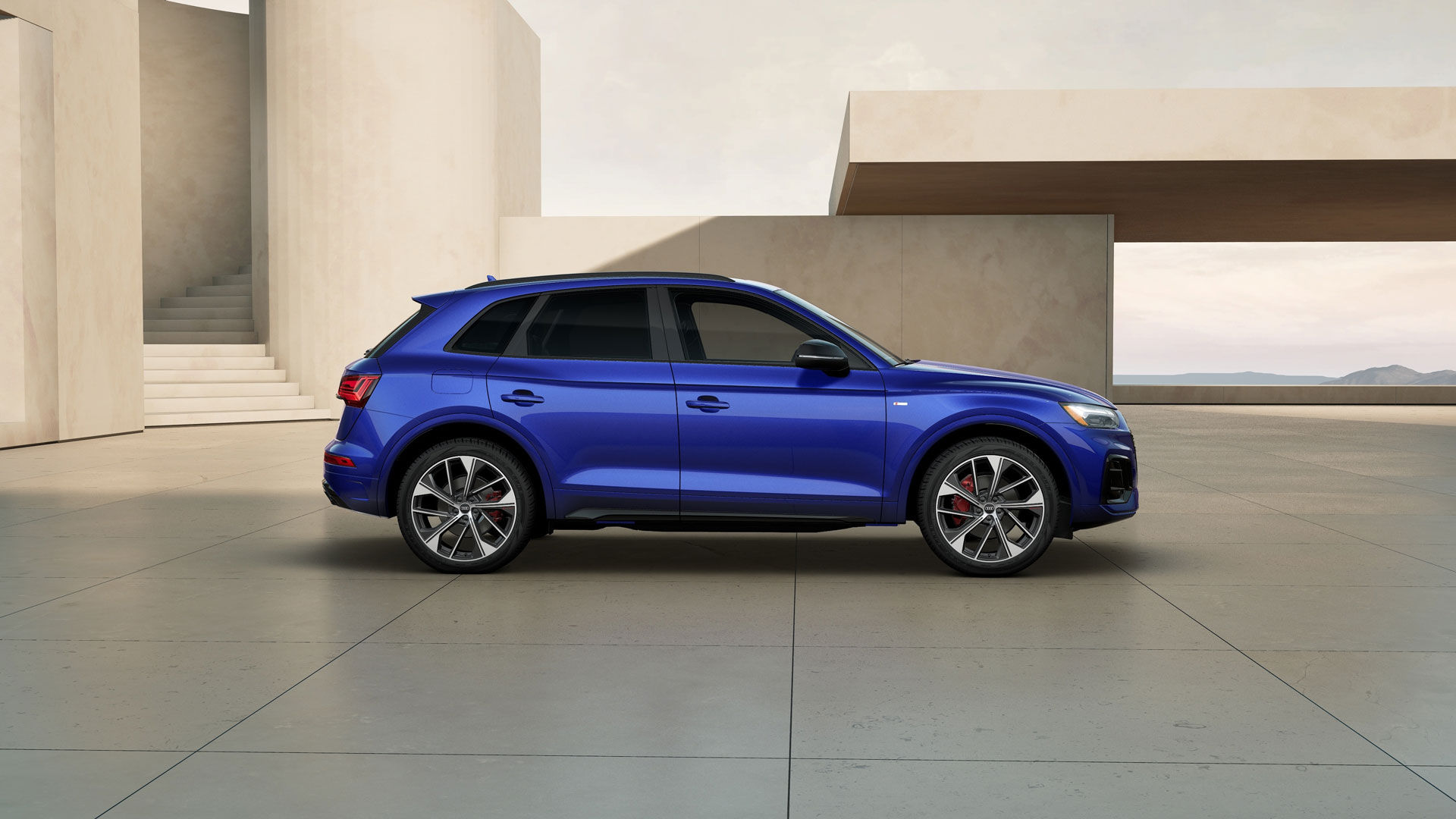 Audi Q5 2025 parked near a building.