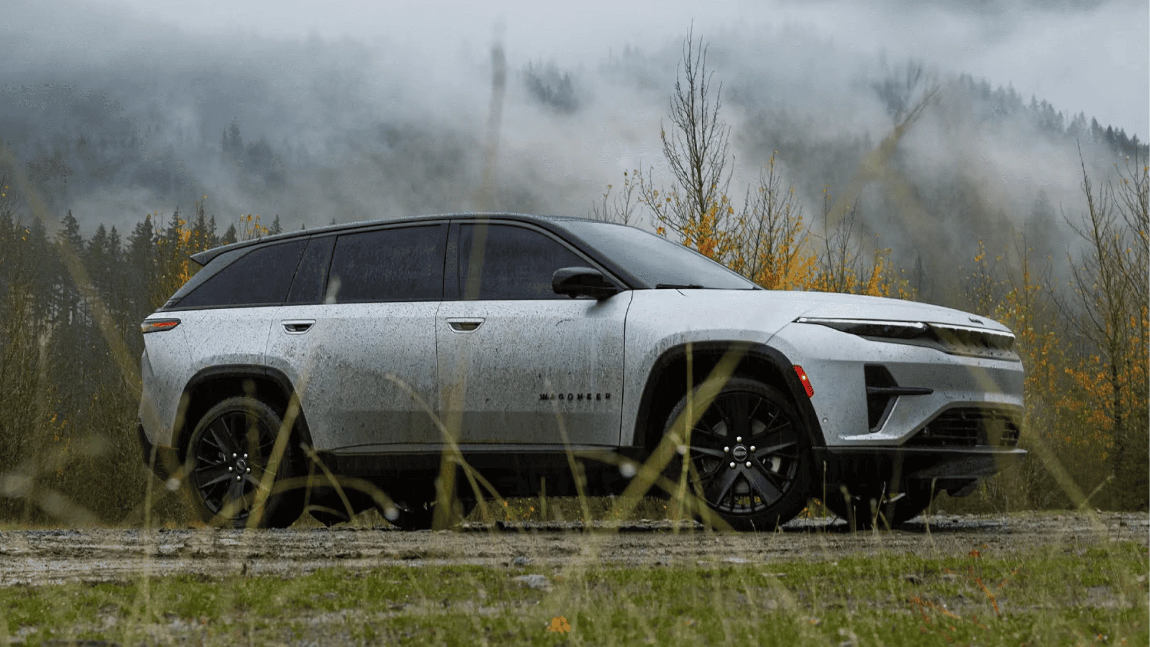 2025 Jeep® Wagoneer S parked in a misty forest setting, highlighting its electric range and rugged capability for Fort Myers, Florida, adventurers.