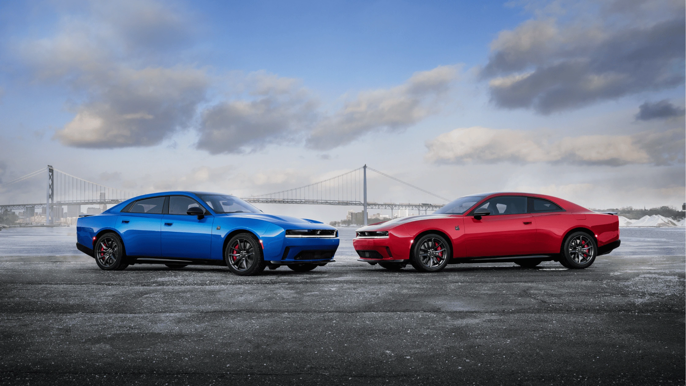 2026 Dodge Charger Daytona in red and blue parked by the bridge in Cape Coral, highlighting bold styling and muscle performance.