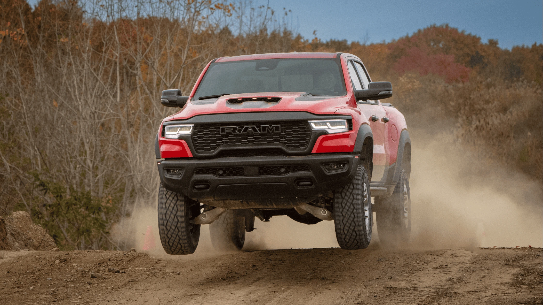 Close-up of a rugged off-road tire and wheel on the 2025 Ram 1500 RHO, showcasing all-terrain capability.