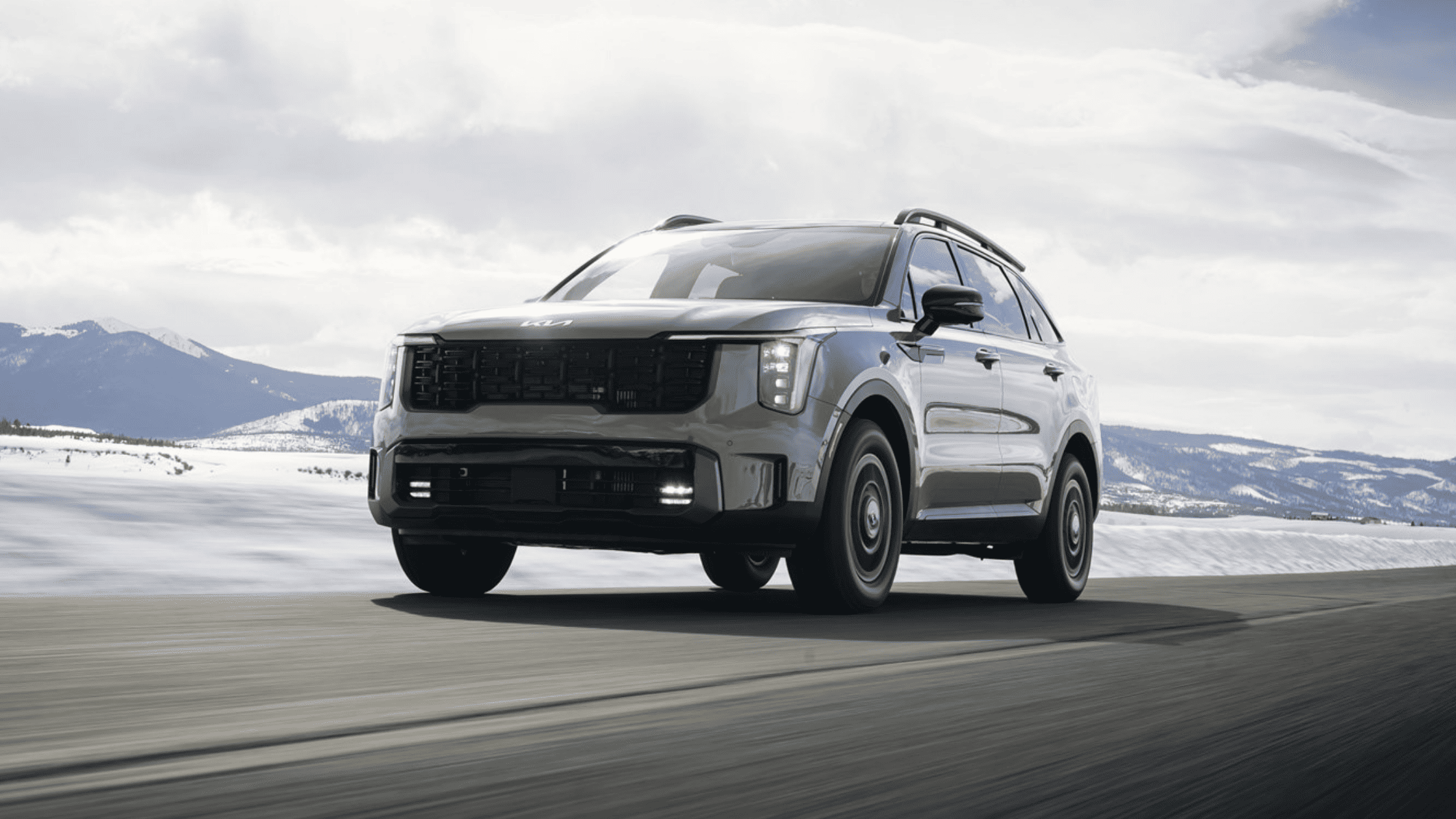 2025 Kia Sorento SUV driving on a snowy mountain road